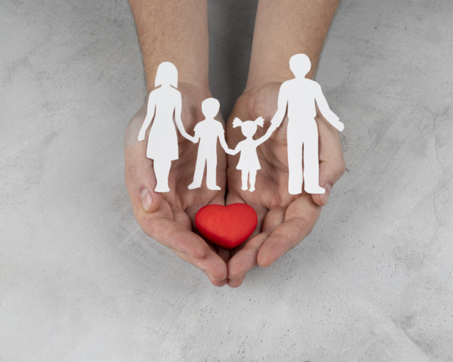 hands-holding-paper-people-heart-close-up